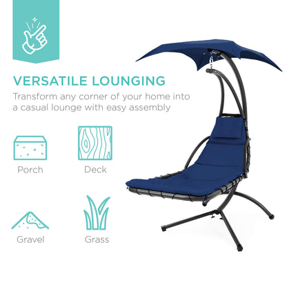 Hanging curved steel chaise lounge swing with canopy and pillow, navy blue.